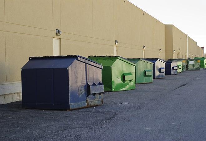 dumpsters with safety cones in a construction area in Clarkson