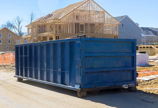 residential dumpster in the front yard of a home